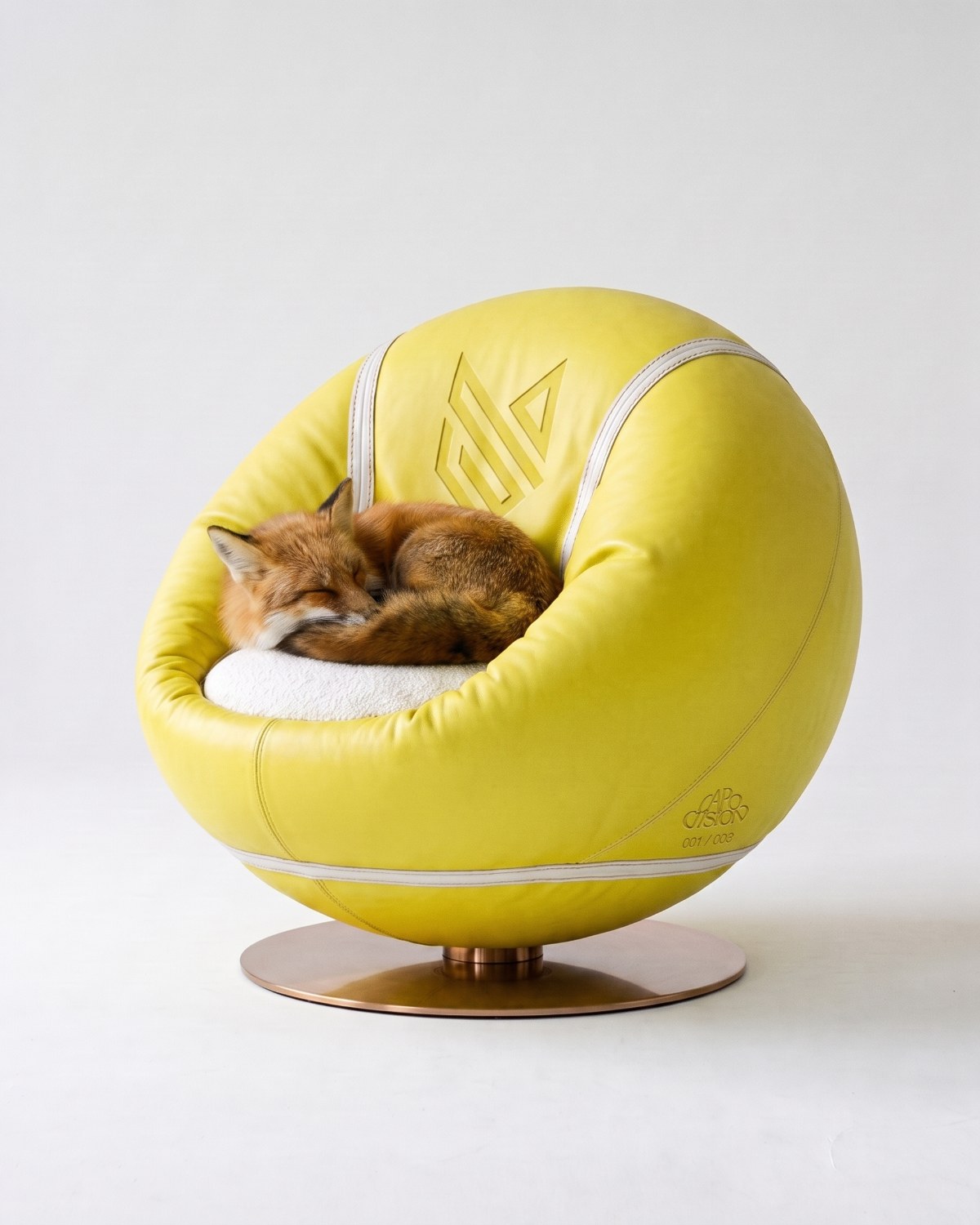DOLOMIA, an armchair in optic yellow napa leather and white bouclé on a burnished bronze base
